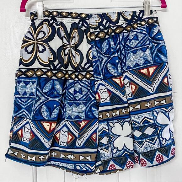 TOMMY BAHAMA • Blue Floral Tropical Tiki Swim Trunks - Picture 1 of 7